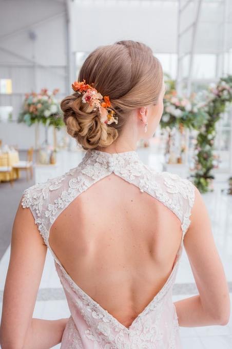 Bride in a Mon Chéri Signature Bridal gown, seen from behind